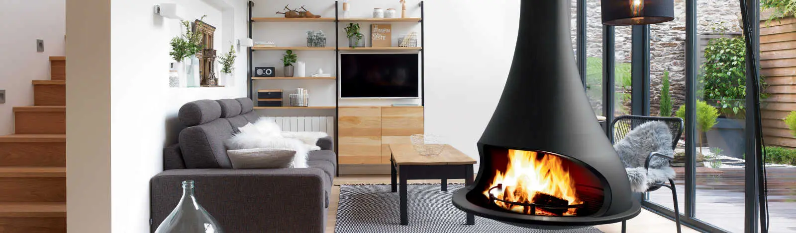 A JC Bordelet suspended central fireplace