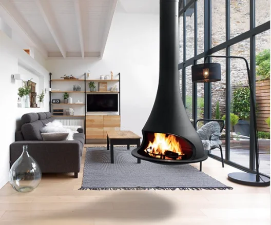 A black suspended JC Bordelet fireplace hanging over a bright open-plan living room