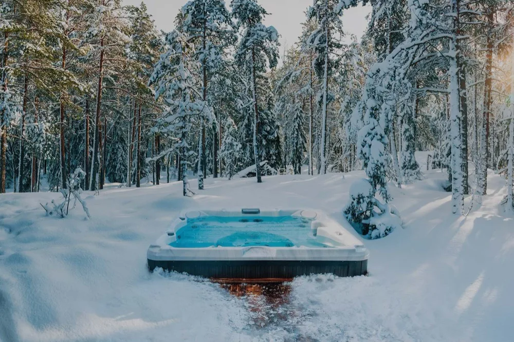 A hot tub deck buried in deep New Brunswick snow — the warm seat in February
