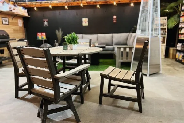 Patio furniture staged under the showroom lights